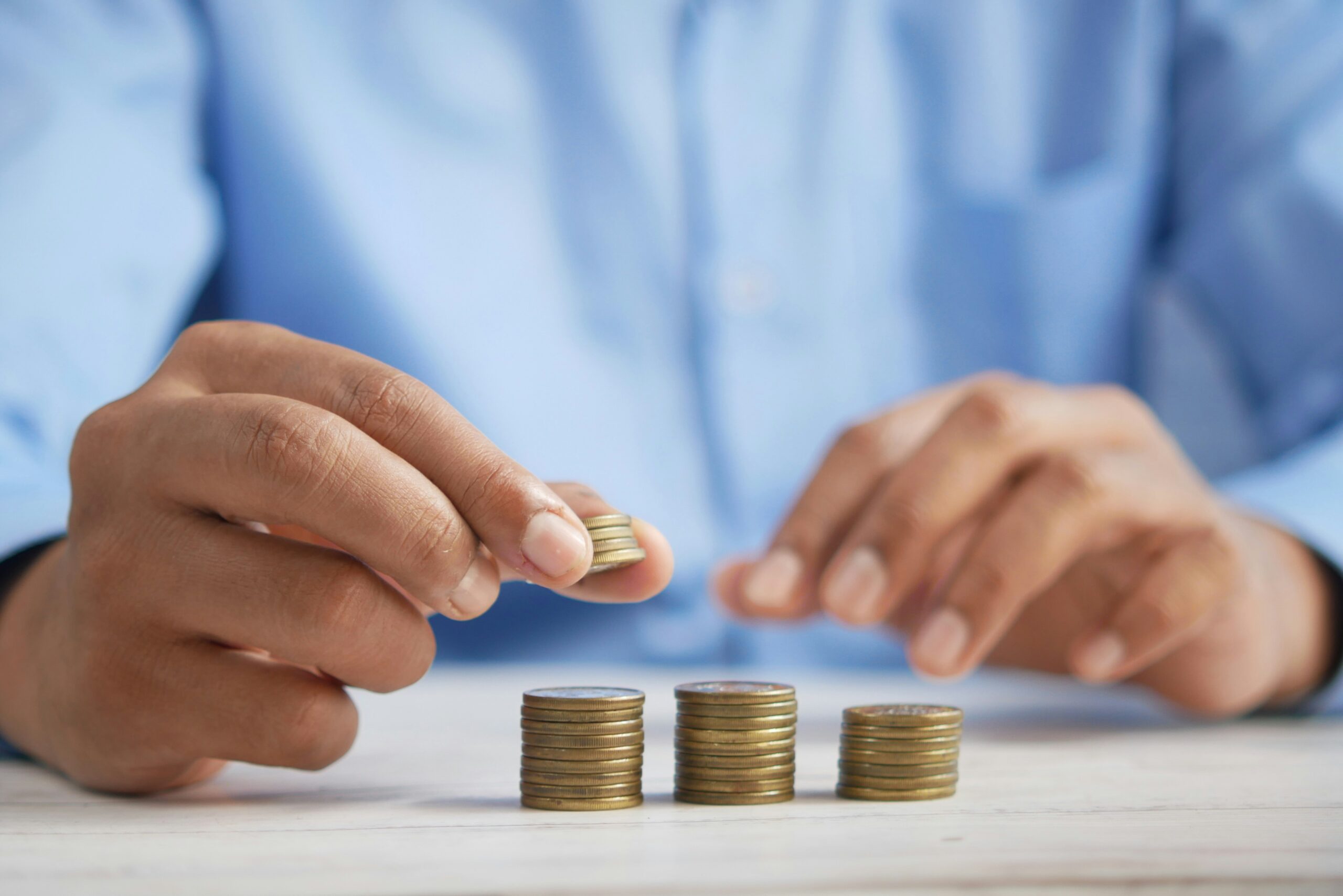 Image of a man counting money, financial tips for singles